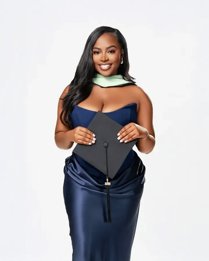 Graduate smiling with her cap and mint stole — Smooth Studios