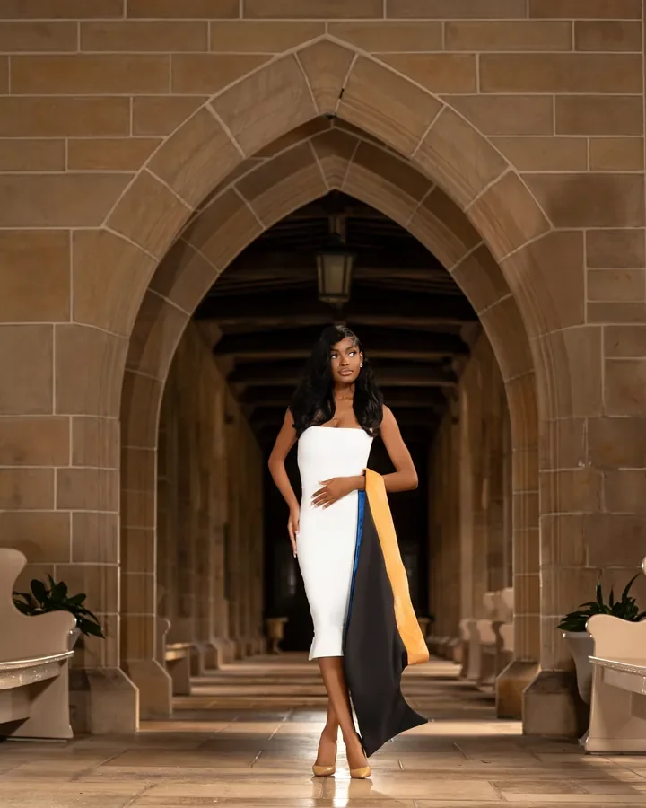 Graduate beneath a stone archway — Smooth Studios