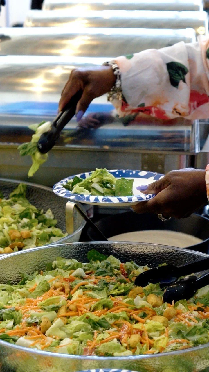 The catering team preparing trays of fresh food