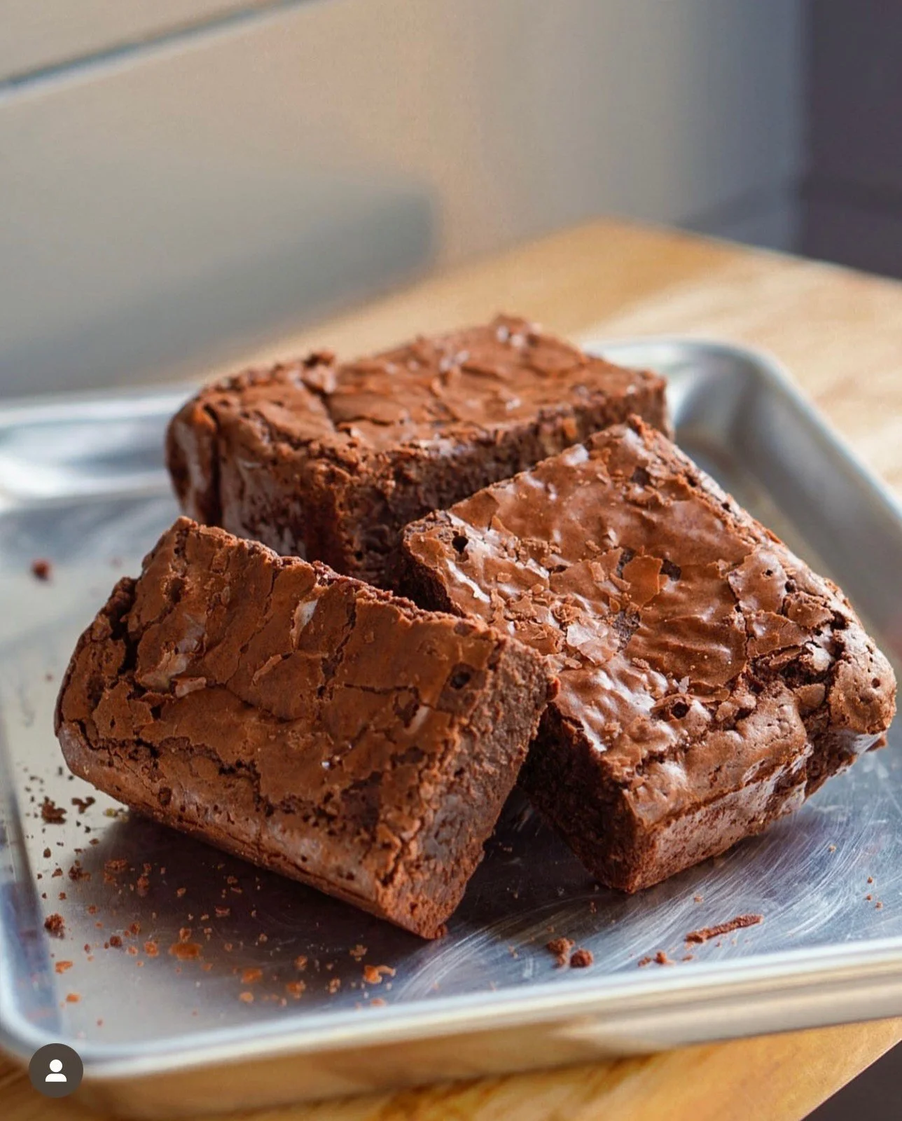 A stack of chocolate brownies on a plate