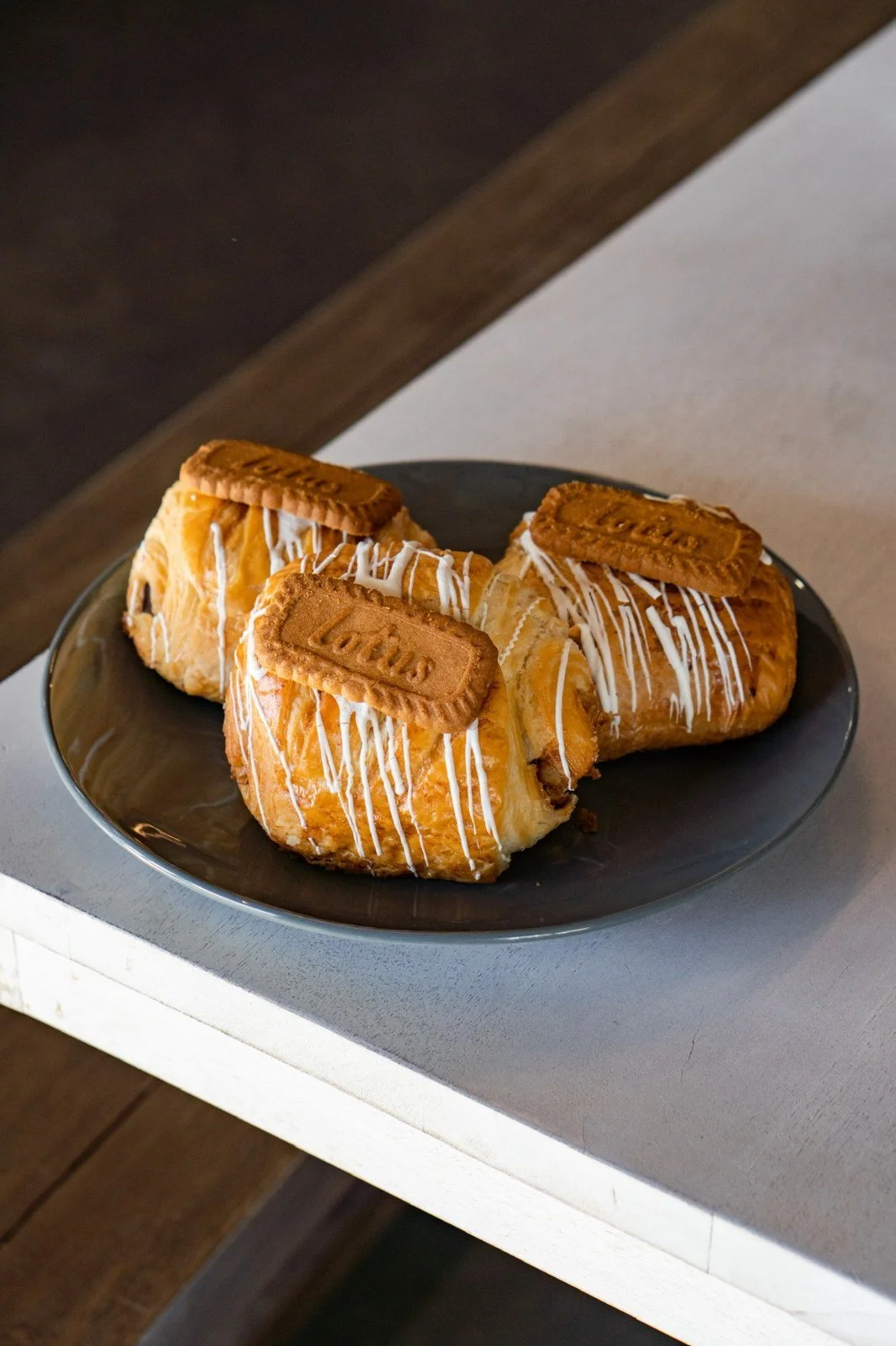 A filled pastry on a plate in afternoon light