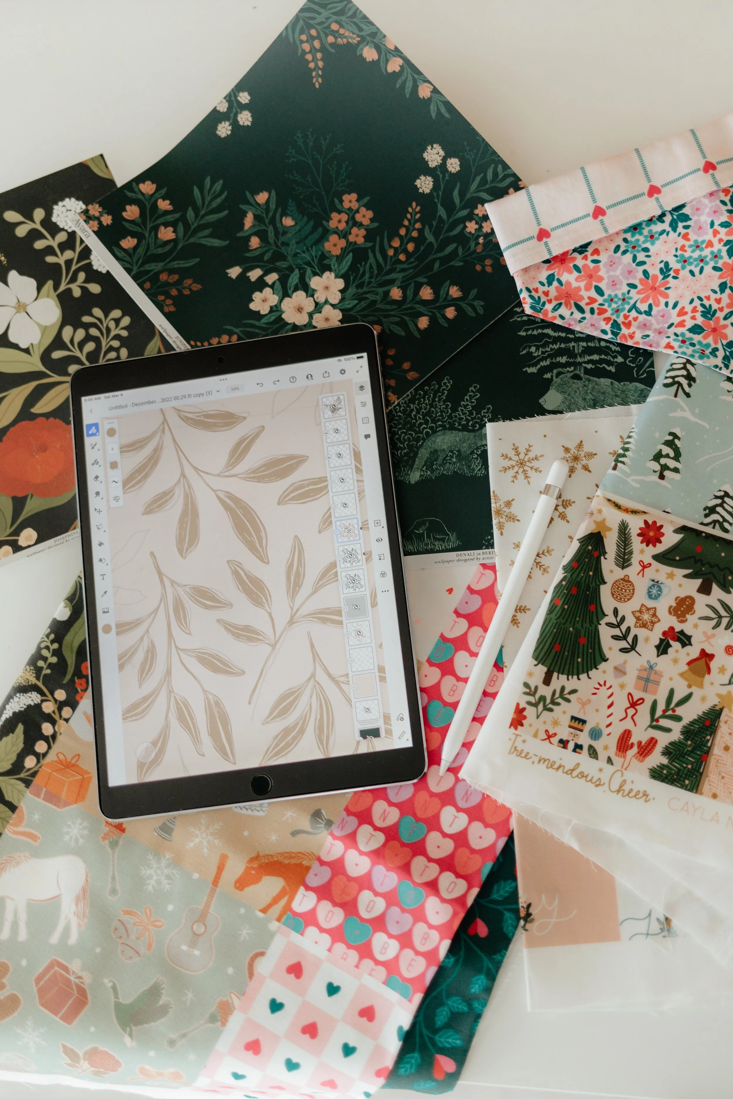 Cayla’s botanical artwork and patterned paper in the studio