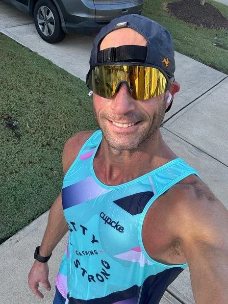 A man in Pretty Strong kit racing in the USA