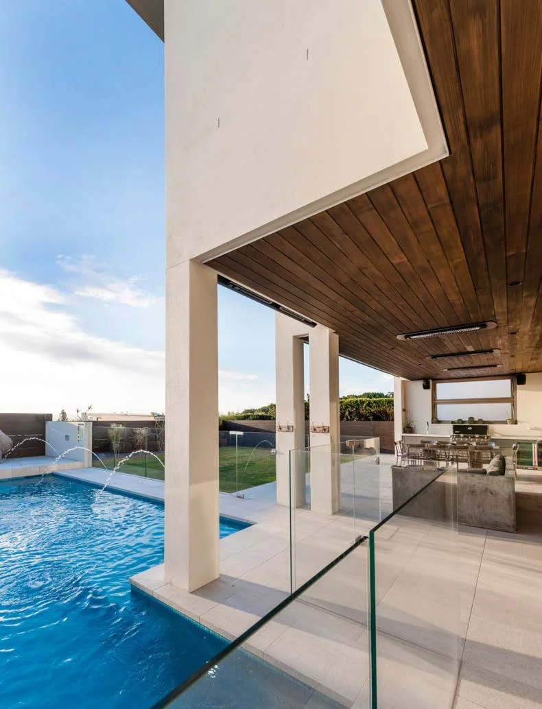 Tungsten Electric heaters recessed into a timber ceiling beside a pool