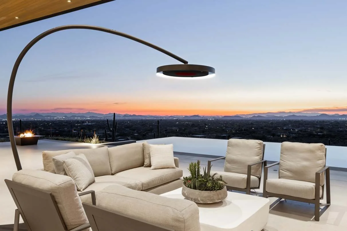 Freestanding Eclipse heater beside a terrace sofa at sunset