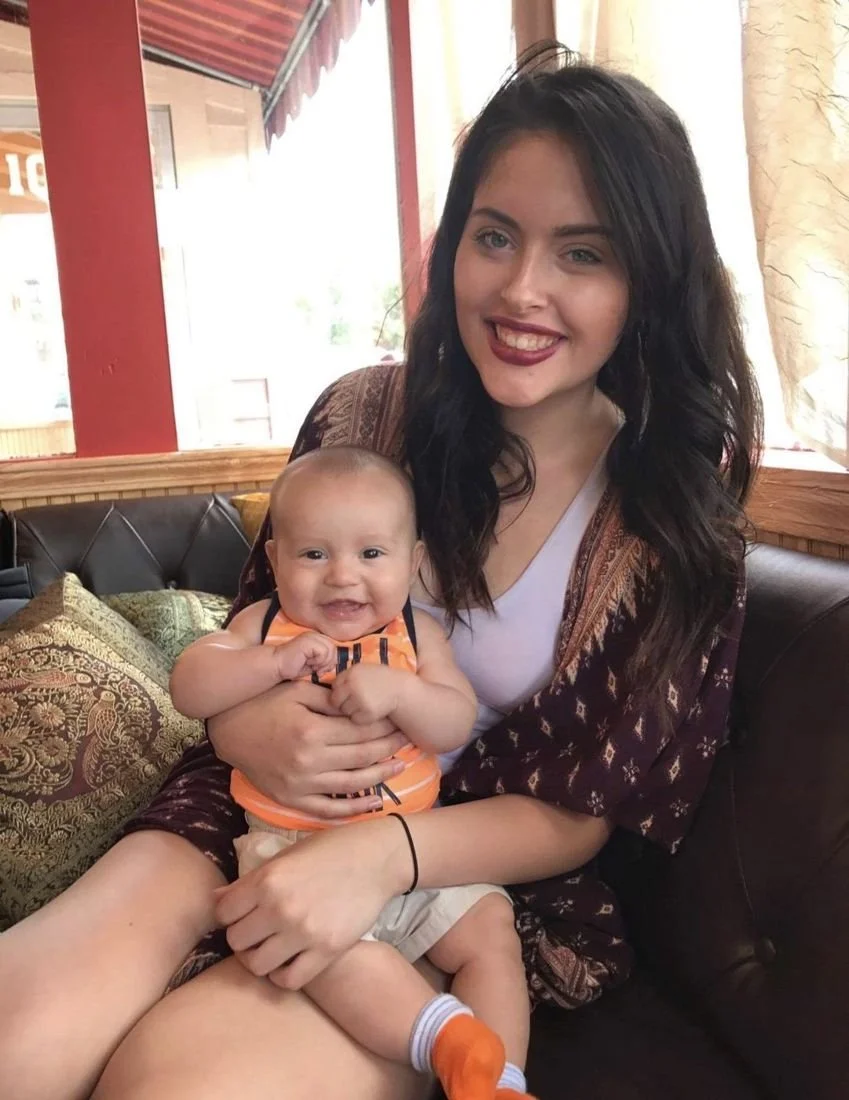 Elizabeth as a young mom holding baby Liam