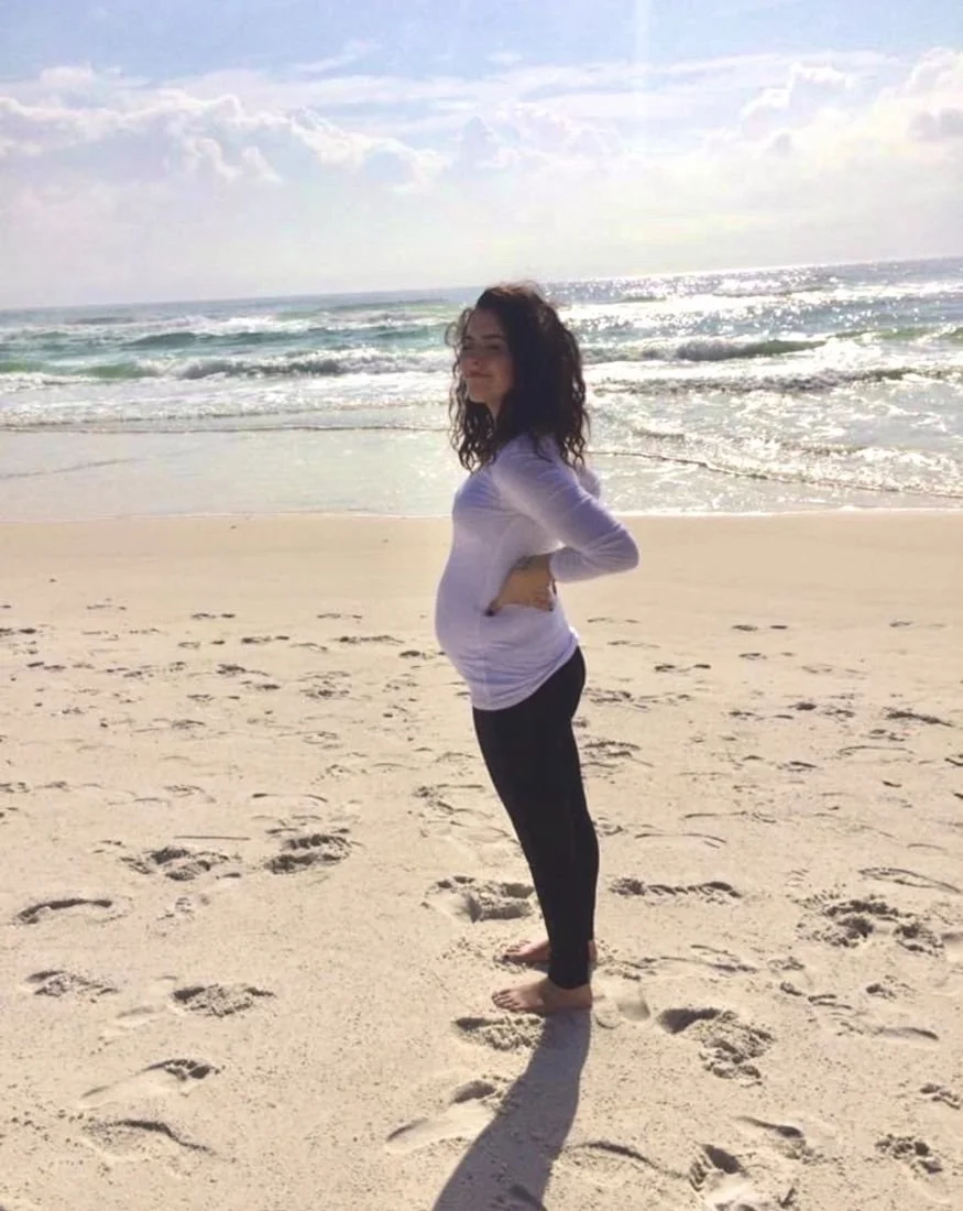 Elizabeth pregnant on the beach