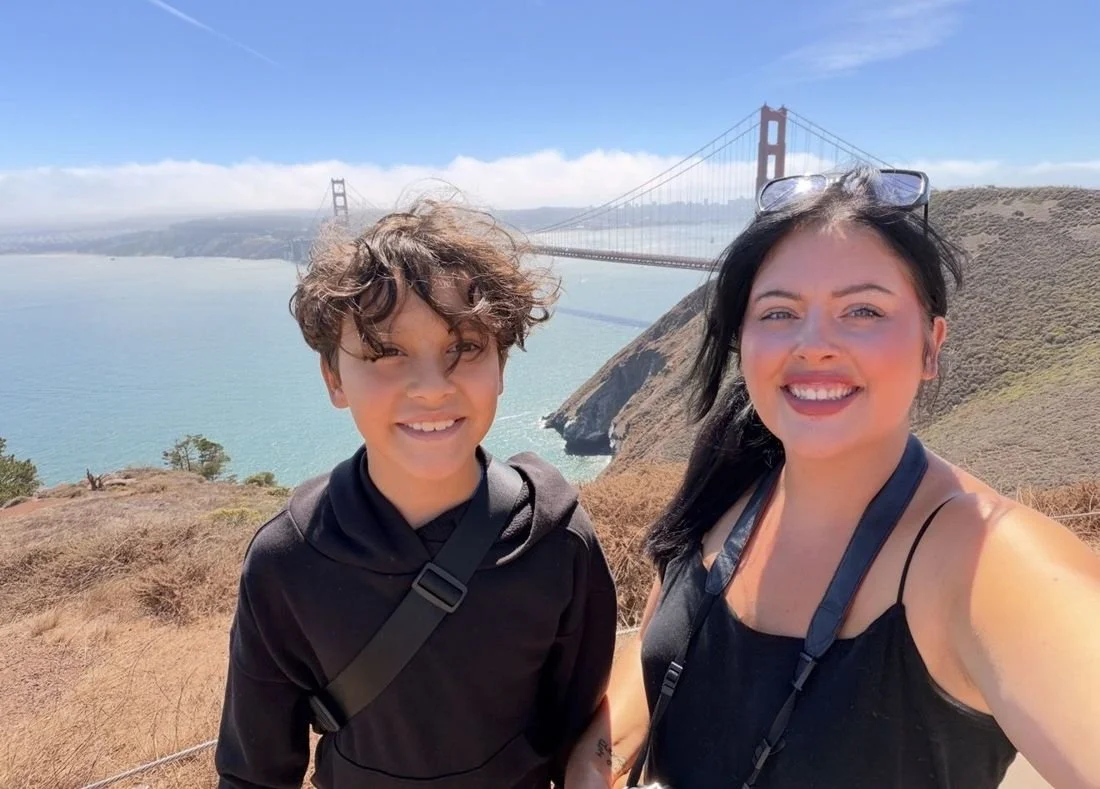 Elizabeth and Liam smiling by the Golden Gate Bridge in San Francisco