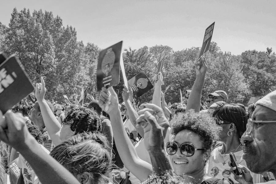 BK Loves MJ tribute placards raised above the Prospect Park crowd