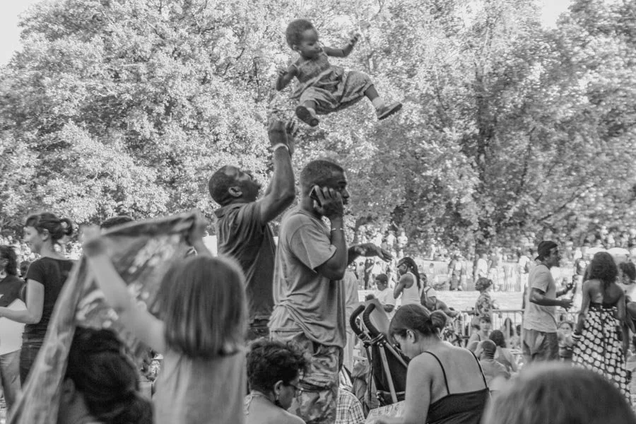Child lifted above the Prospect Park crowd during BK Loves MJ