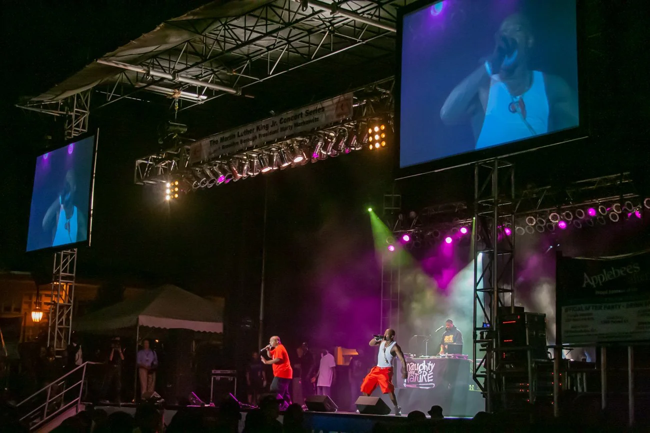 Wide stage view of Naughty by Nature performing at Wingate Field