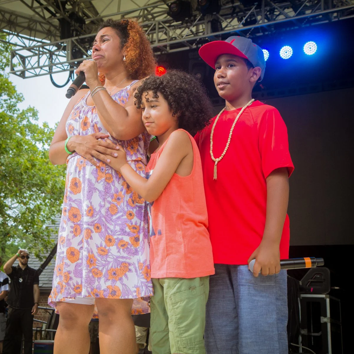 Pumpkinhead's wife and sons thank the audience during a tribute honoring the late Brooklyn MC.
