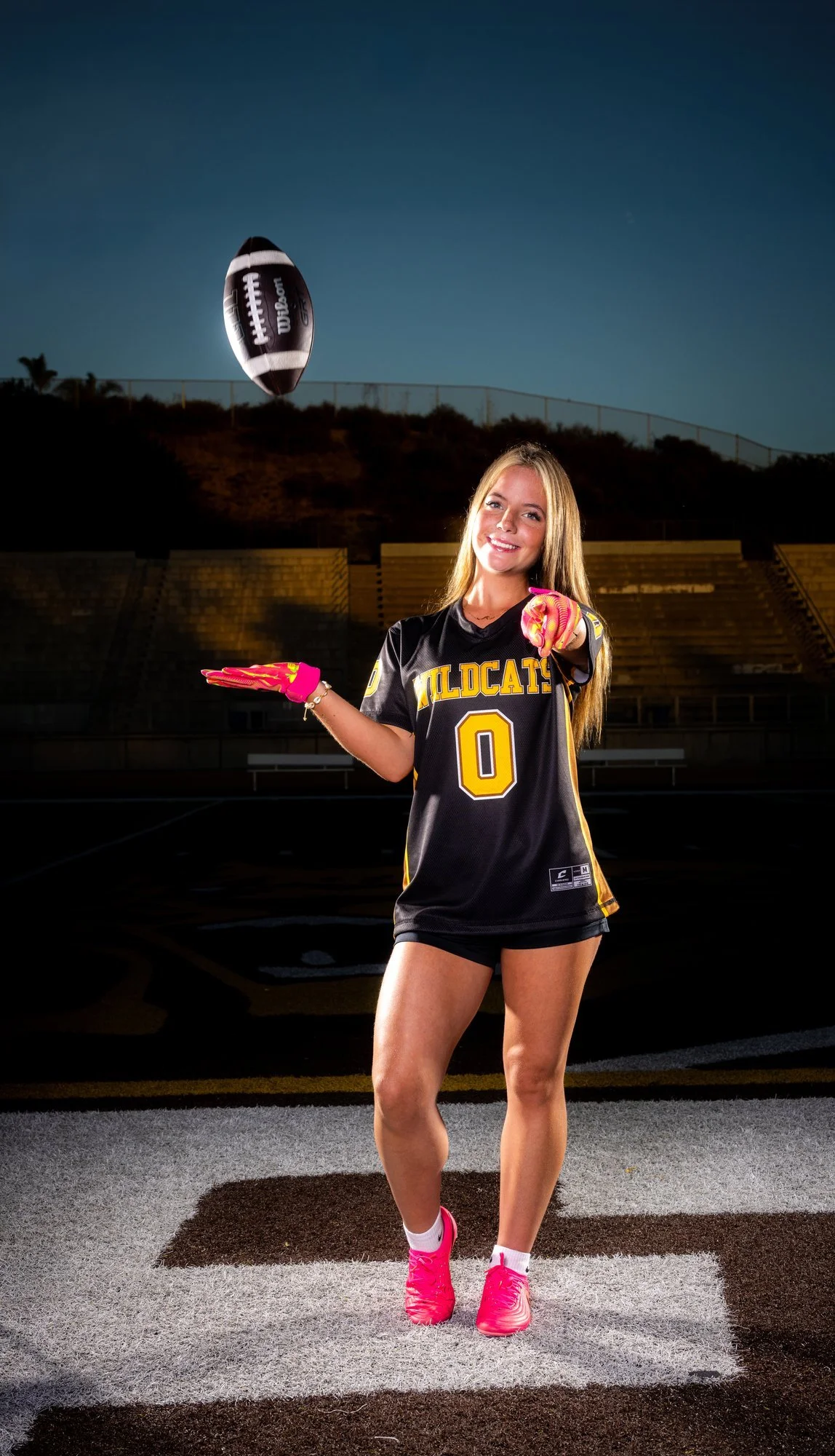 El Camino Wildcats flag football athlete making a catch, full body in motion