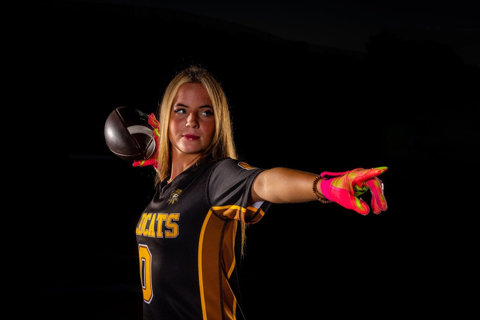 Dynamic athletic action portrait of an El Camino Wildcats flag football athlete