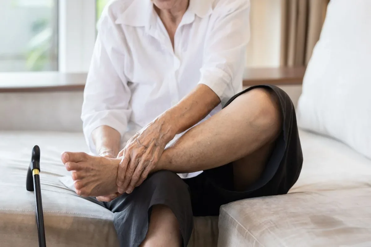 Senior caring for her feet at home