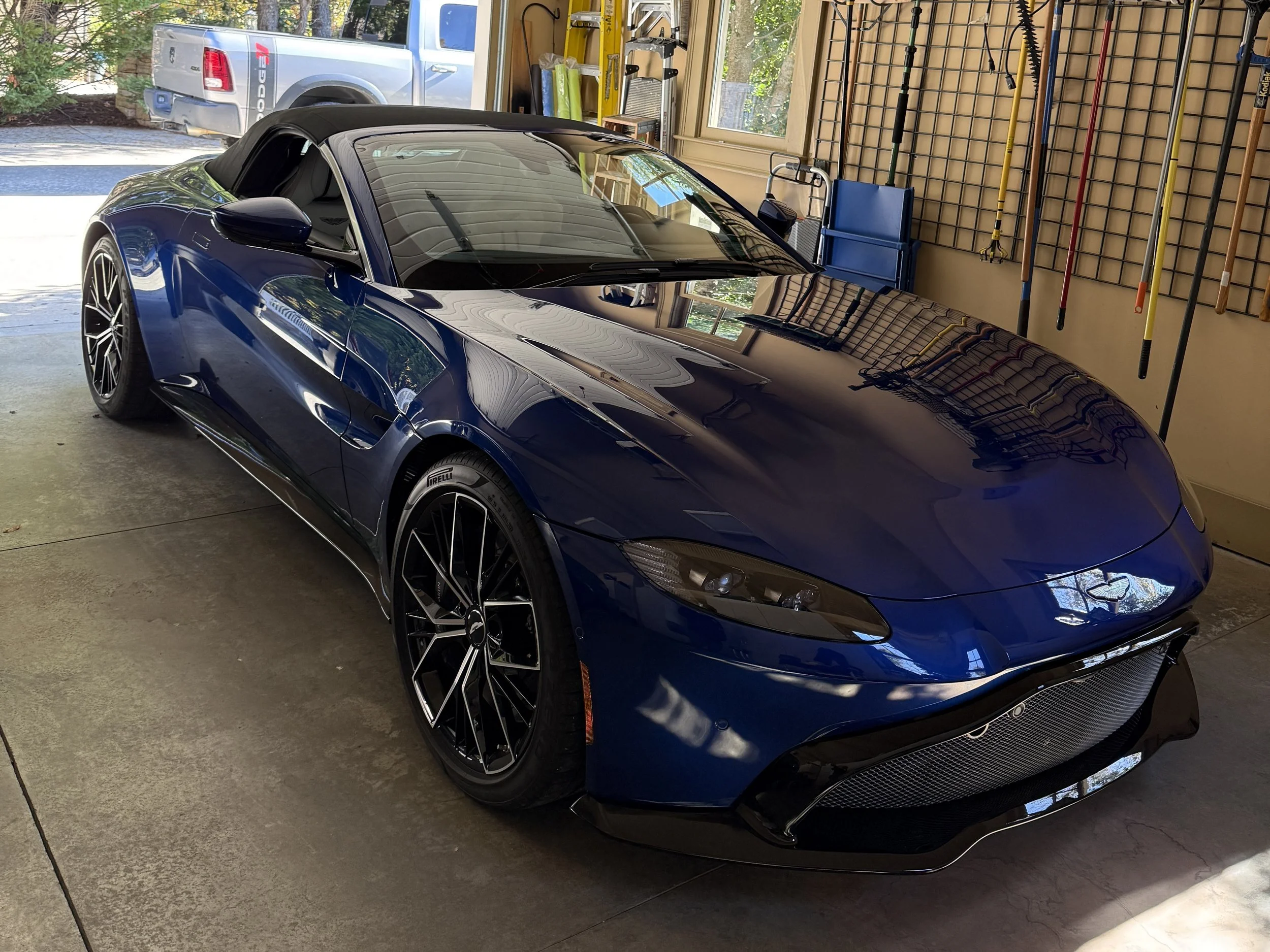 Hand detailing Aston Martin with precision