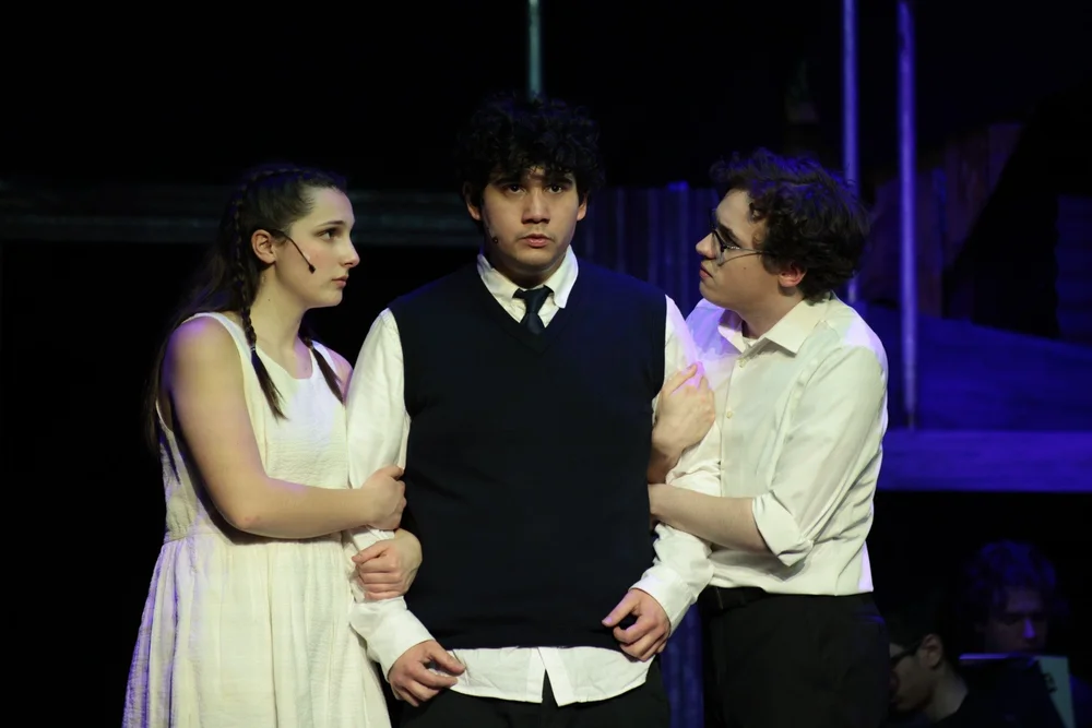 Actors in period costume onstage in Spring Awakening