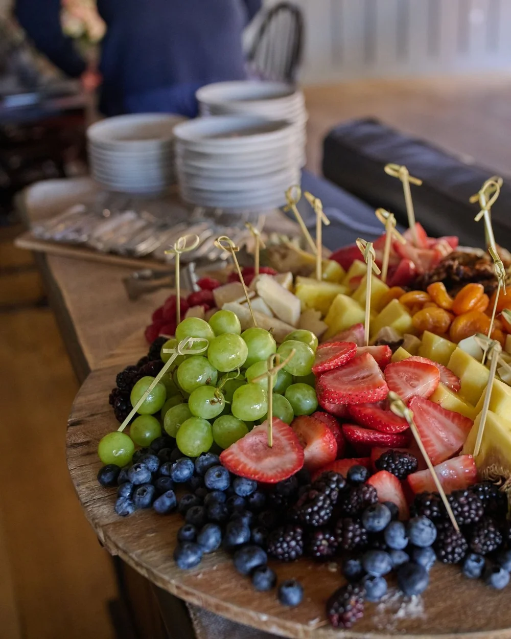 Seasonal fruit platter with grapes, berries and pineapple