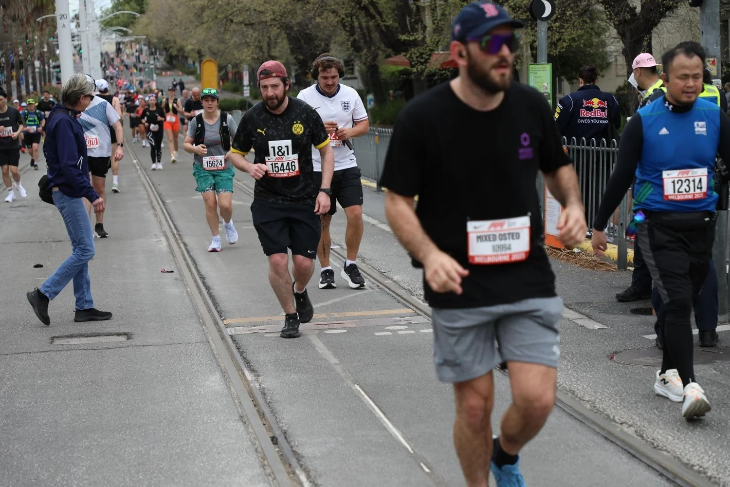 Dr Luke Smith running along St Kilda Road during the 2025 Melbourne Marathon