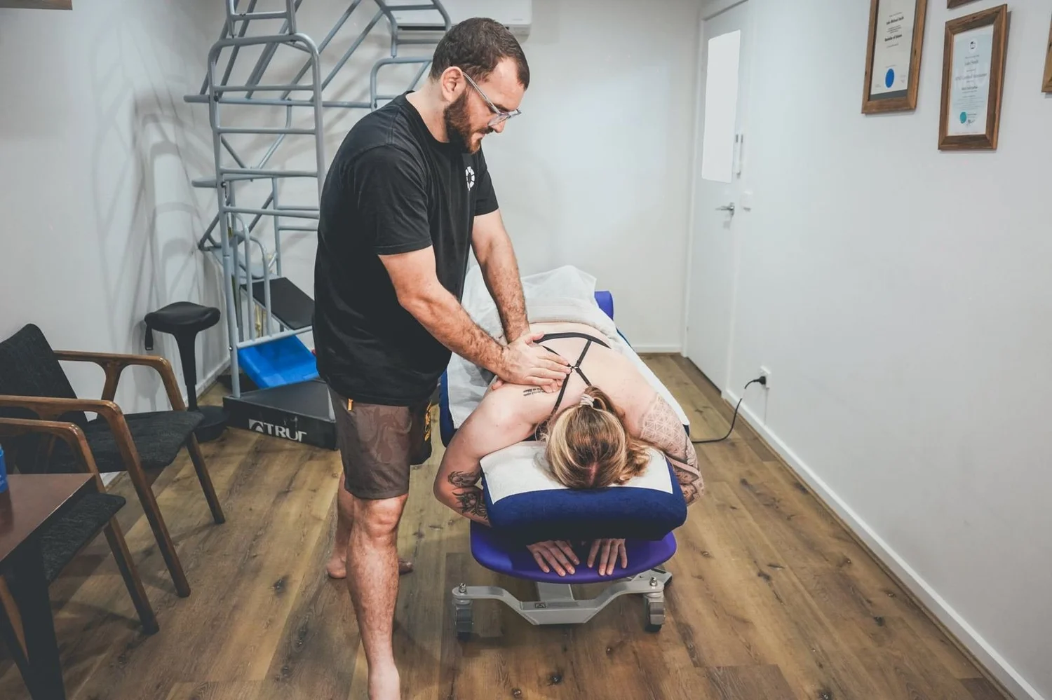 Dr Luke Smith treating a patient in the Mixed Osteo clinic room at 92 Parsons Street, Kensington