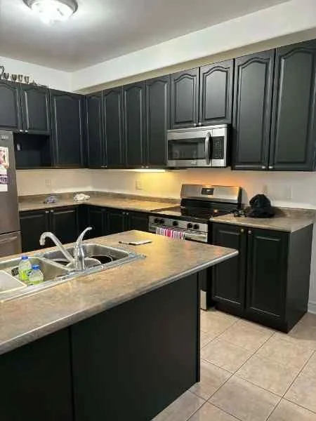HVLP spray finishing commercial cabinetry in Barrie Ontario by Eagle Crest Painting and Coatings