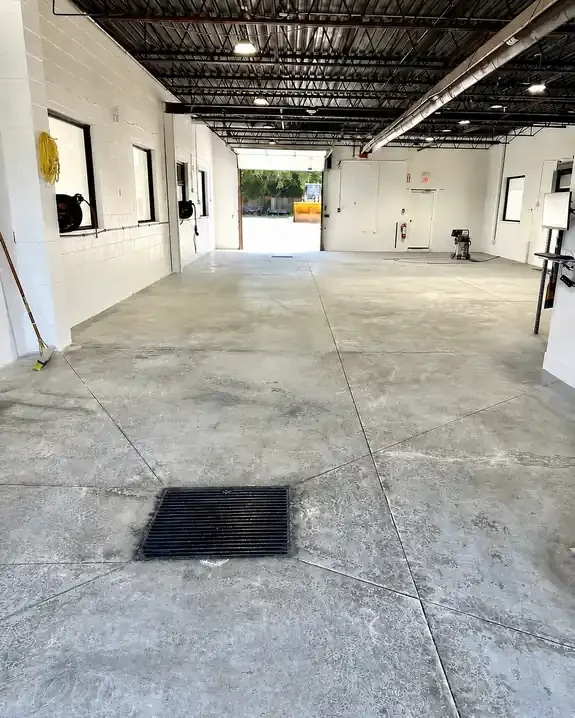 Concrete floor before epoxy coating by Eagle Crest Painting & Coatings