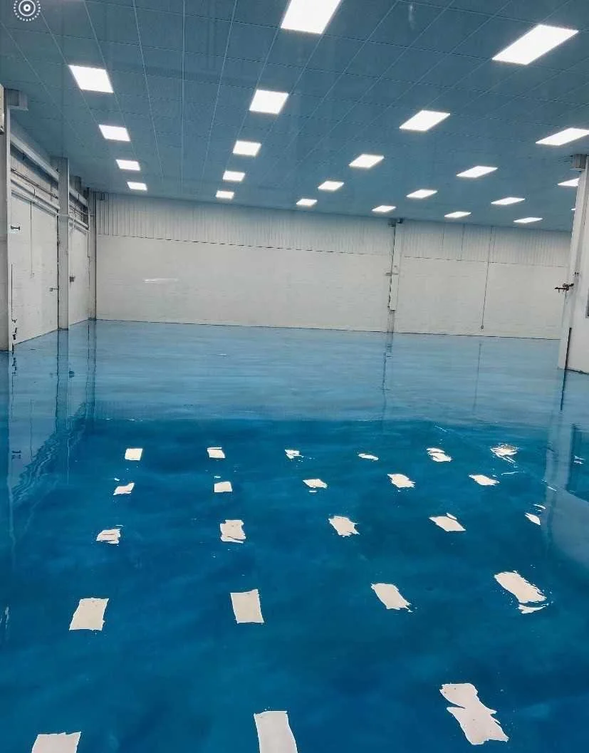 Commercial blue epoxy flooring project by Eagle Crest Painting