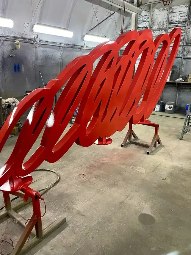 Metal sign after electrostatic painting