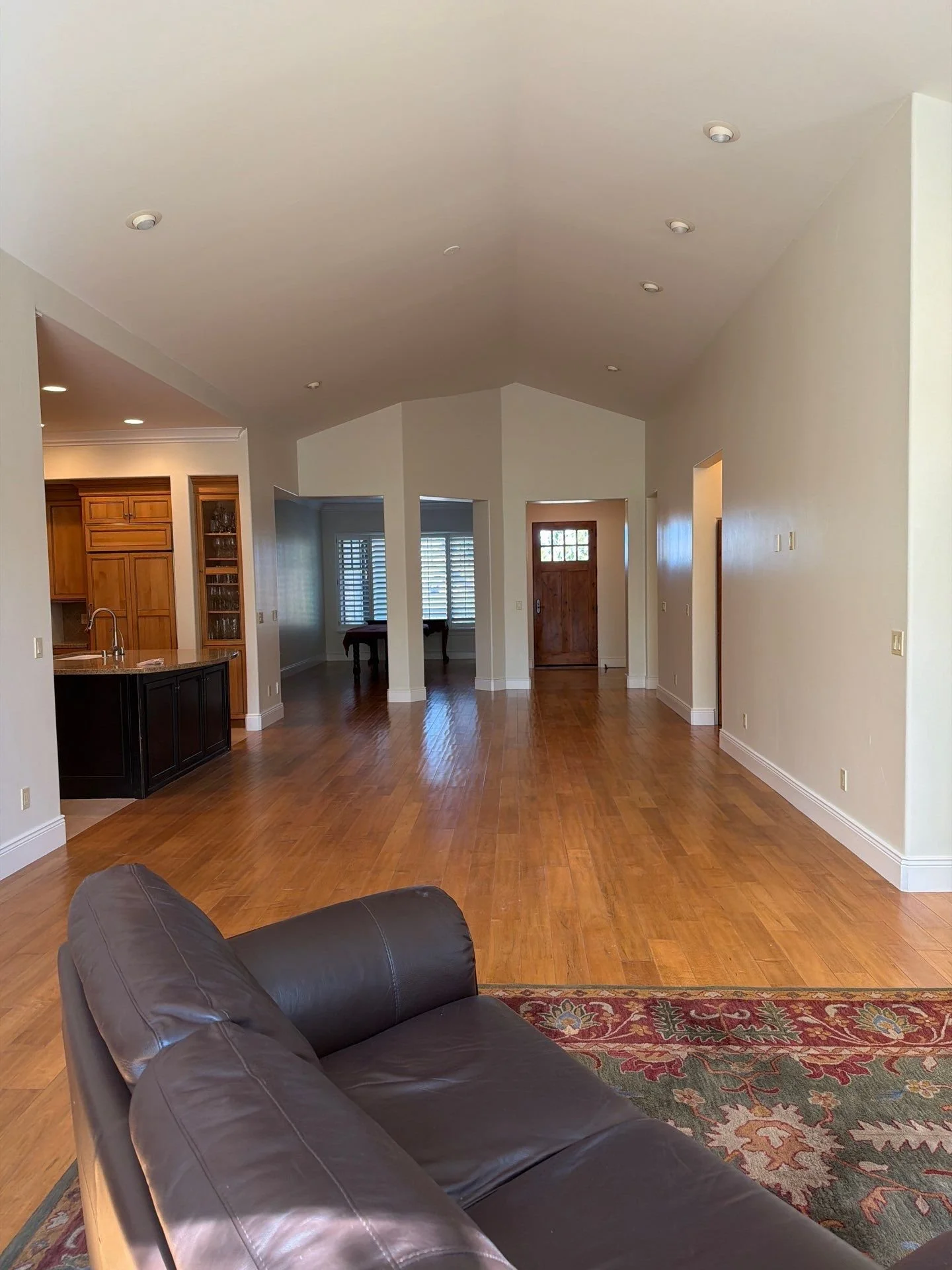 Freshly painted vaulted great room with white baseboards in a South Reno home