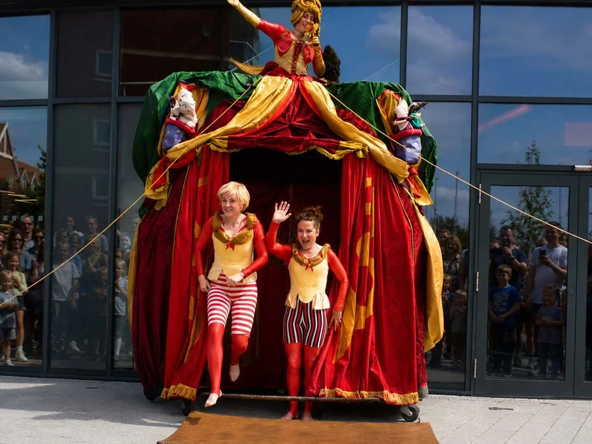 Dress Circle performers emerging from their colourful mobile theatre.