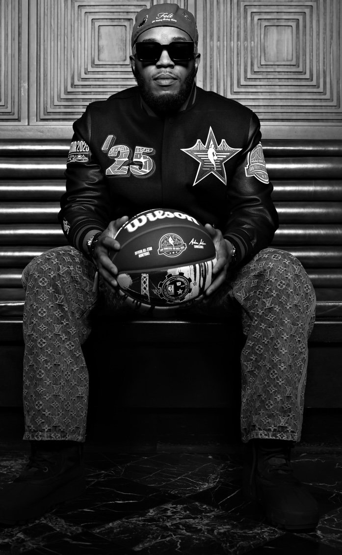 Randy C. Paschal seated with a basketball in a black and white portrait
