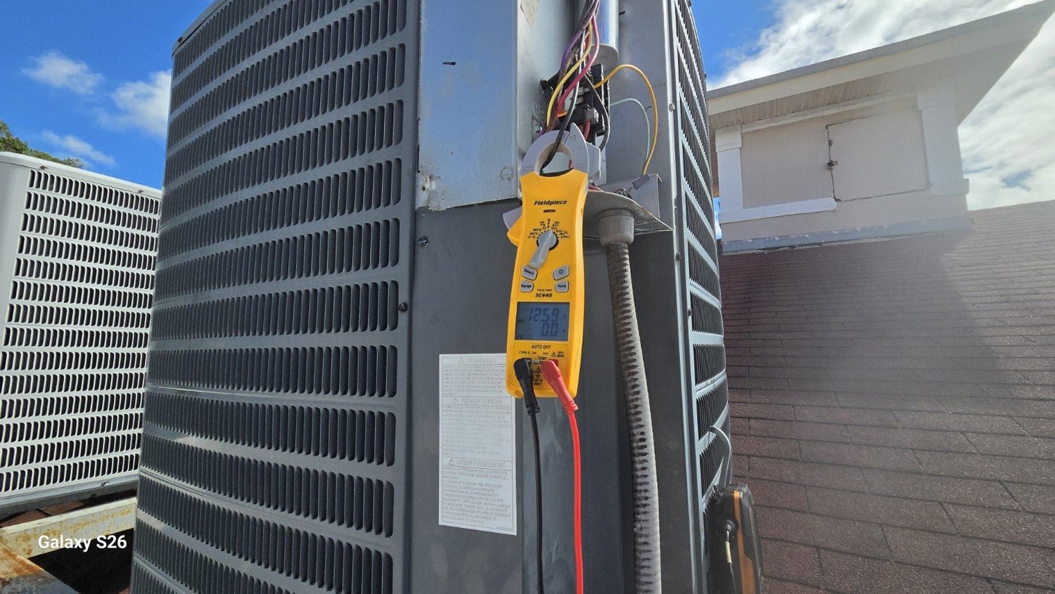 Electrical testing equipment connected at the church AC condenser