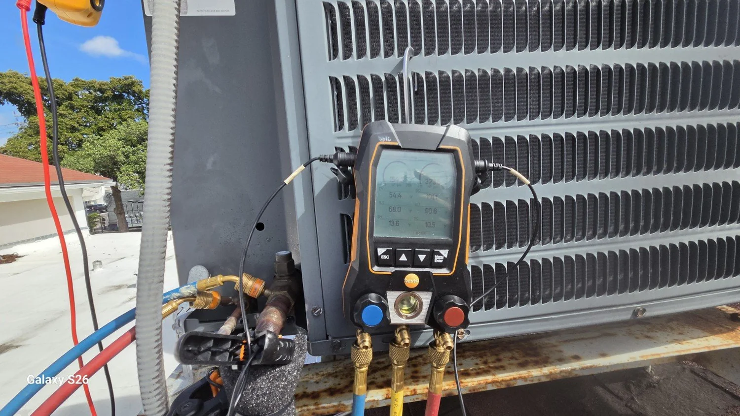 Digital service gauges connected to the AC condenser at the Miami church