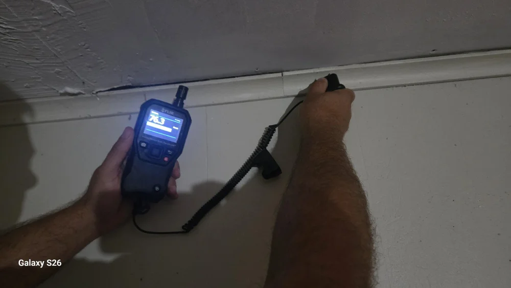 Moisture meter and probe used at the ceiling and upper wall in Fort Lauderdale