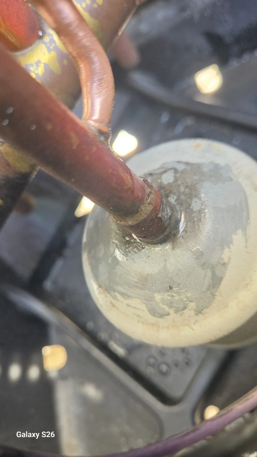 Close-up of the refrigerant connection repair area at the Doral AC project