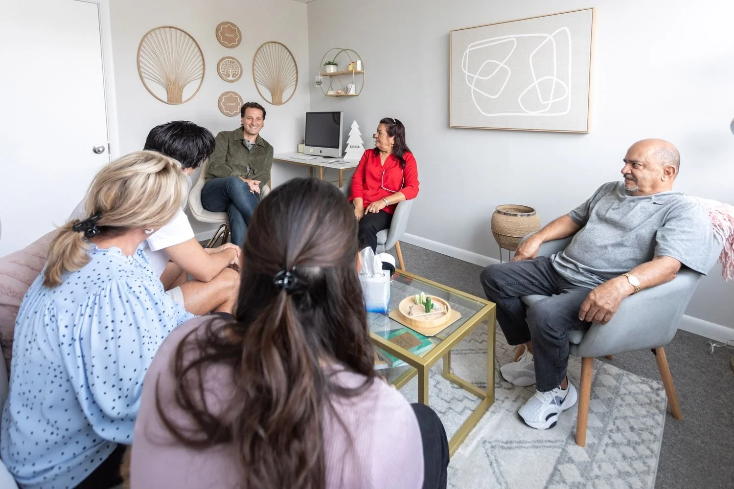 A group gathered in a Broward Therapists therapy room