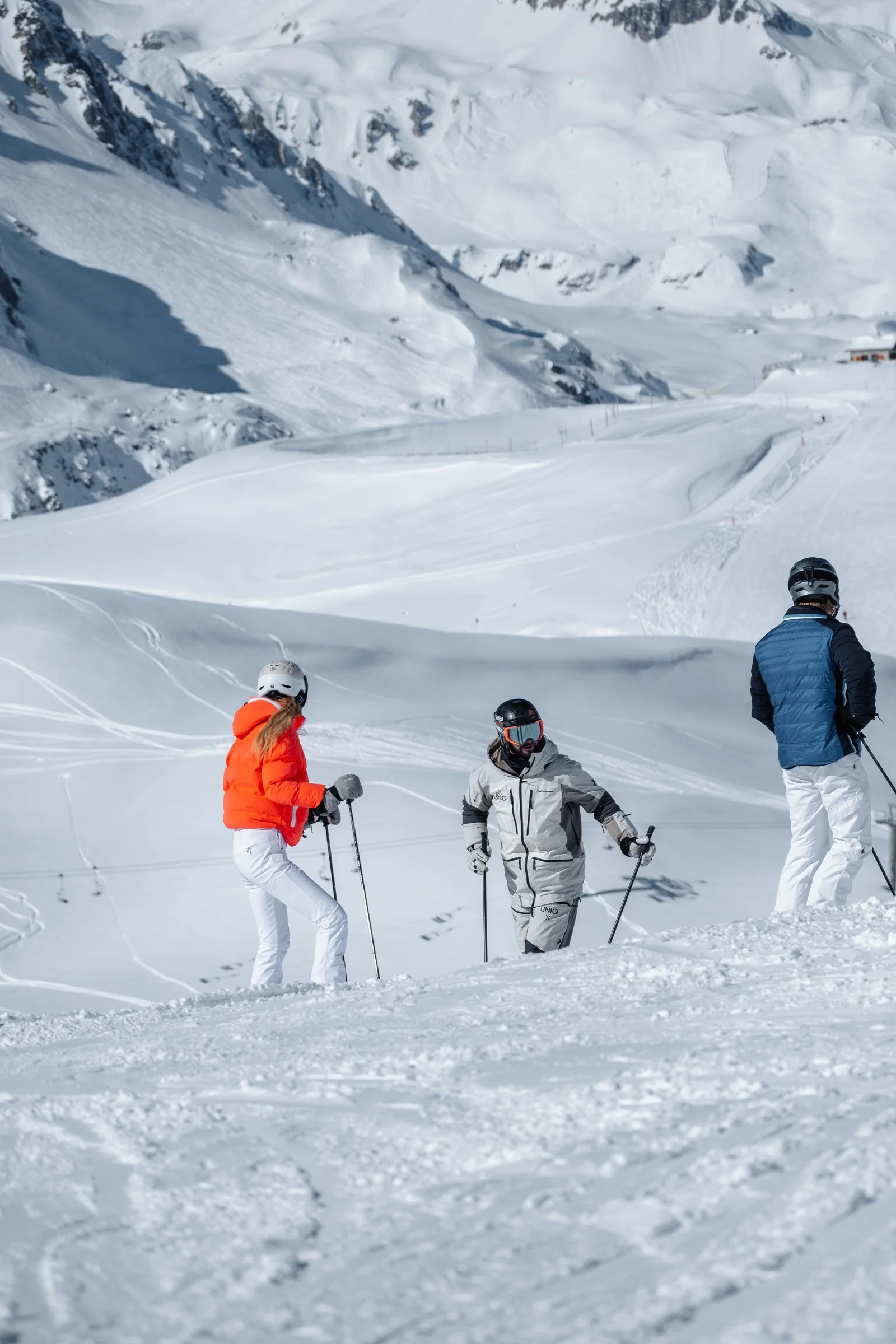 Skiers taking a moment together on the mountain