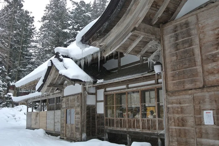 Traditional Japanese architecture beneath winter snow