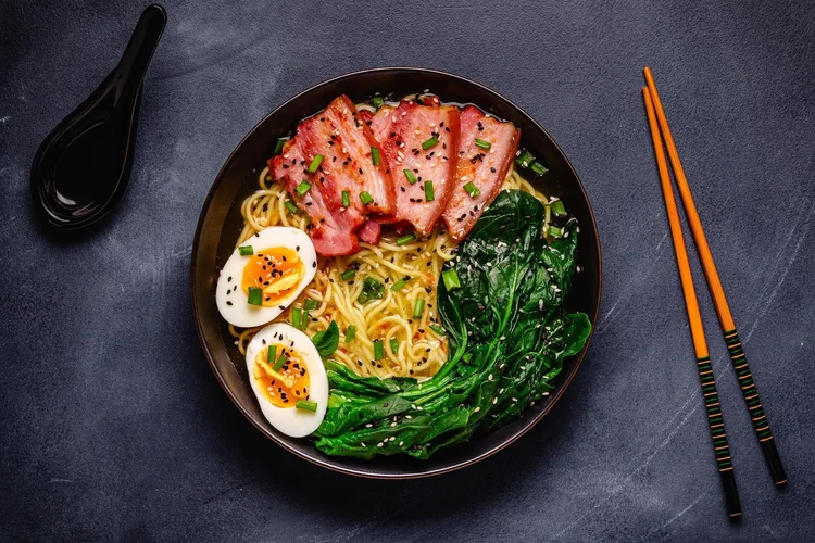 Japanese ramen bowl with noodles, egg and greens