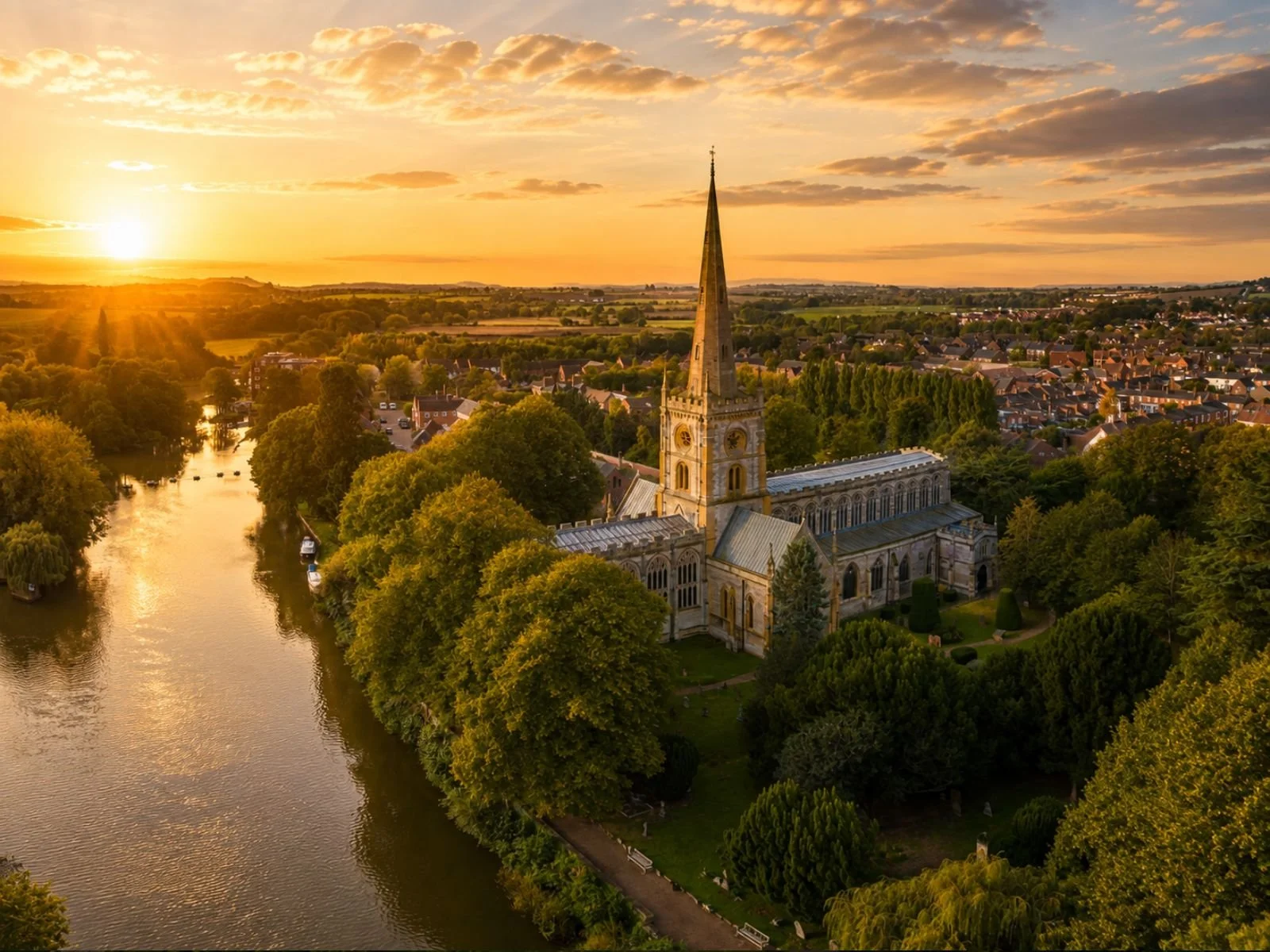 View across historic Stratford-upon-Avon townscape, Holy Trinity Church, and the River Avon