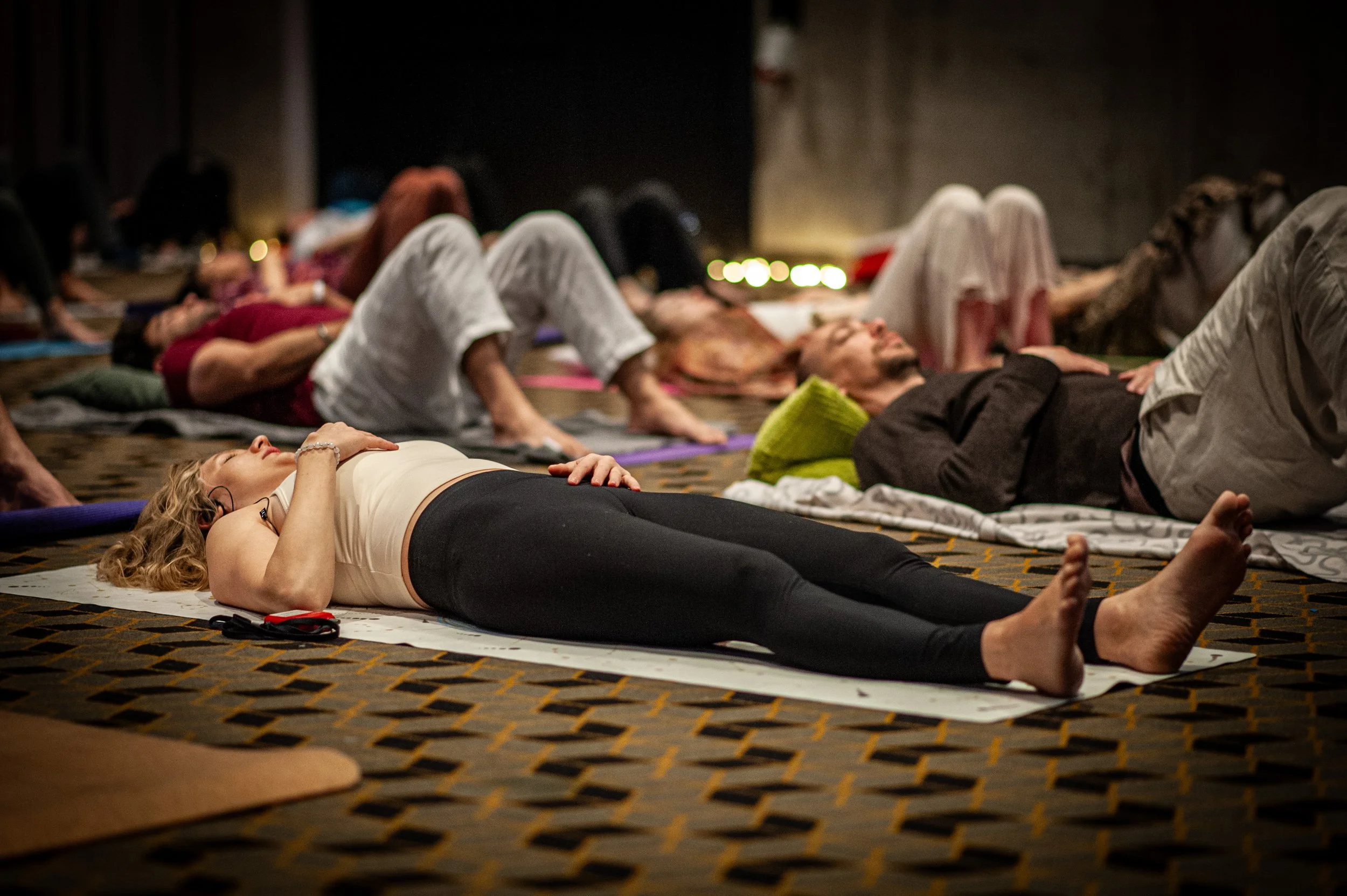Participants resting together at the end of a session, from a past edition.