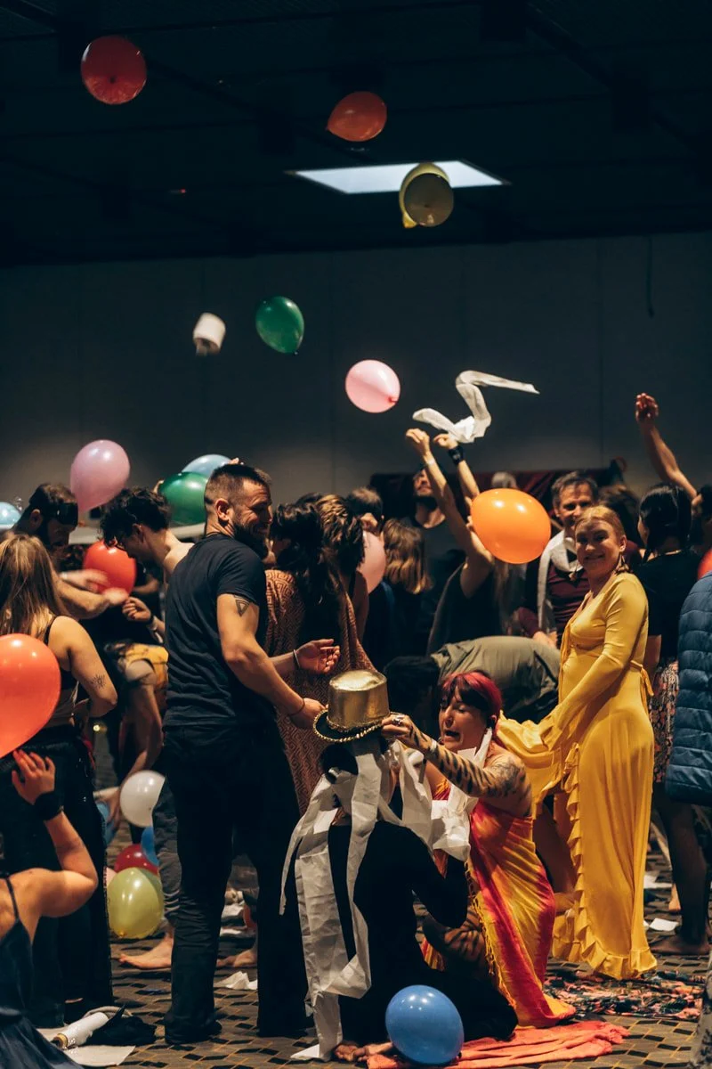 Participants celebrating together during an evening session, from a past edition.