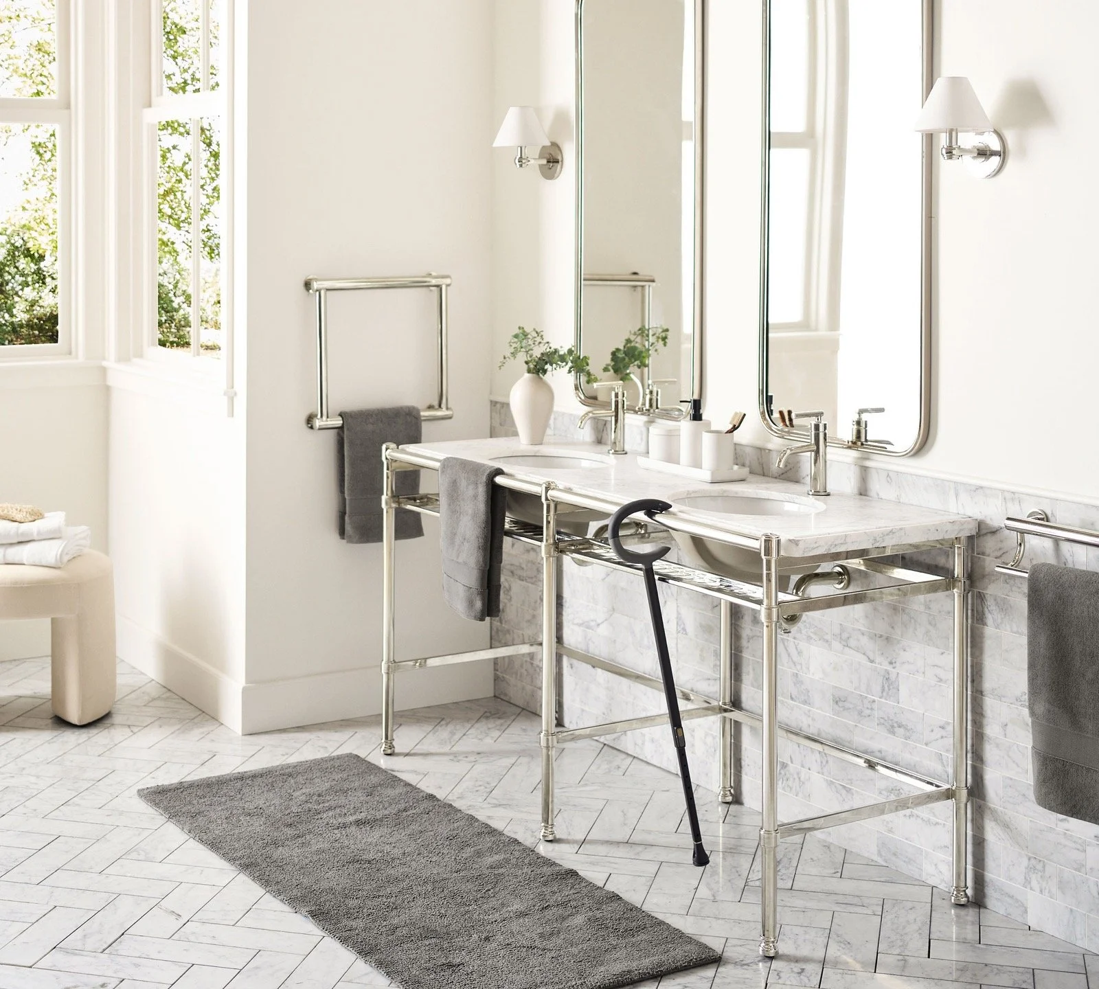 Michael Graves Design’s accessible Pottery Barn bathroom collection, with a vanity, framed mirror and support rails.