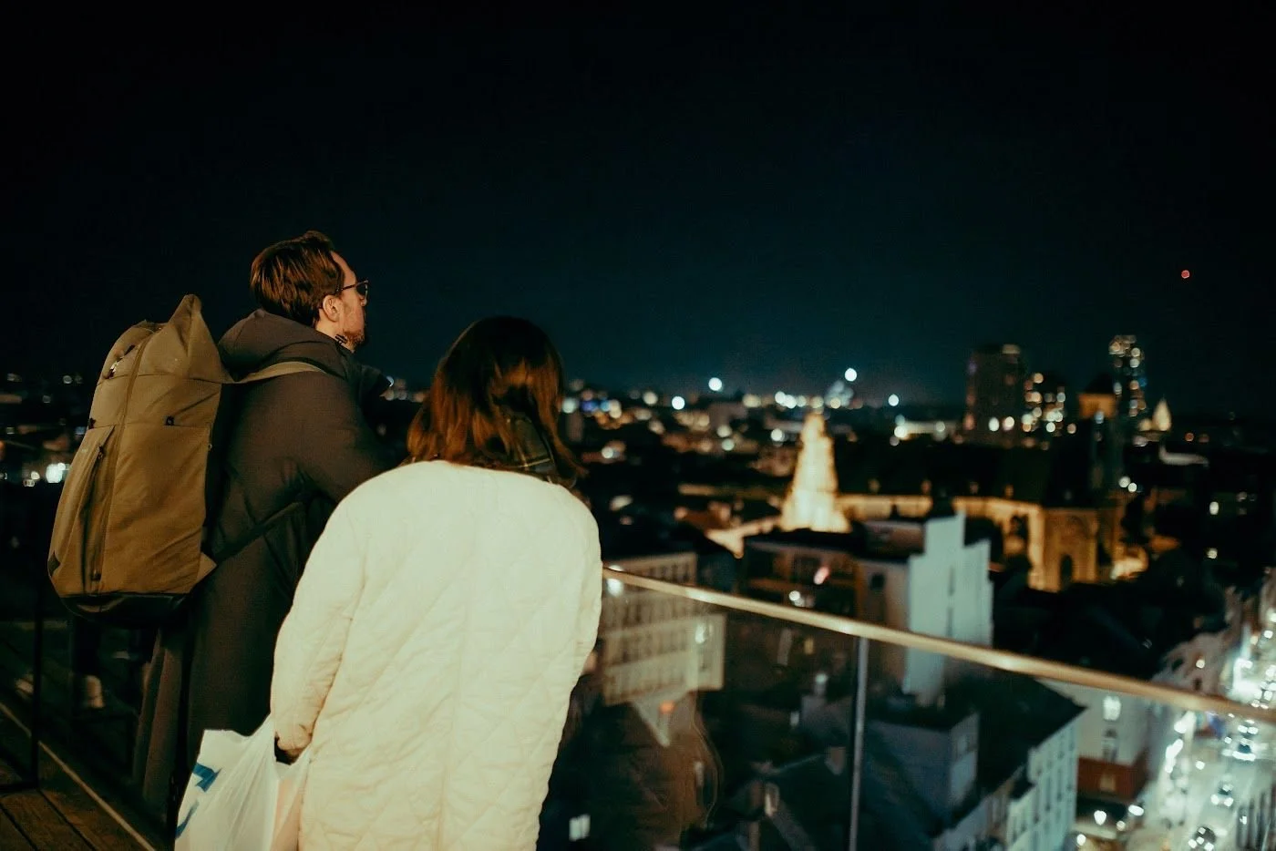 Friends taking in the night view from the Penthouse