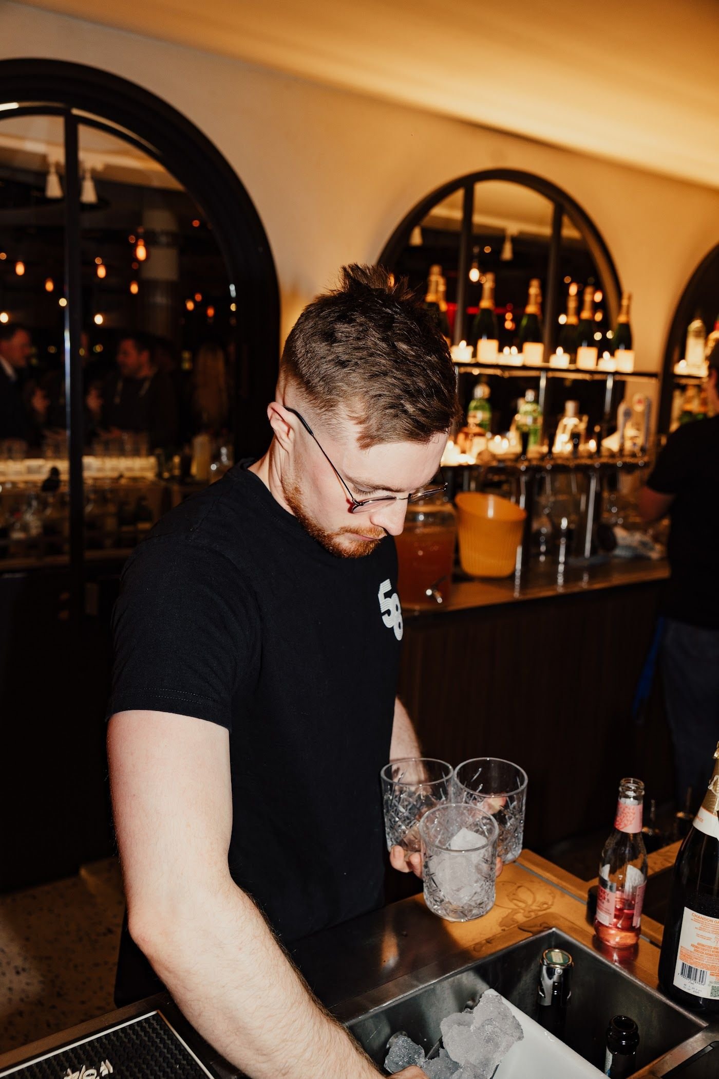 Bartender preparing drinks at the Penthouse bar