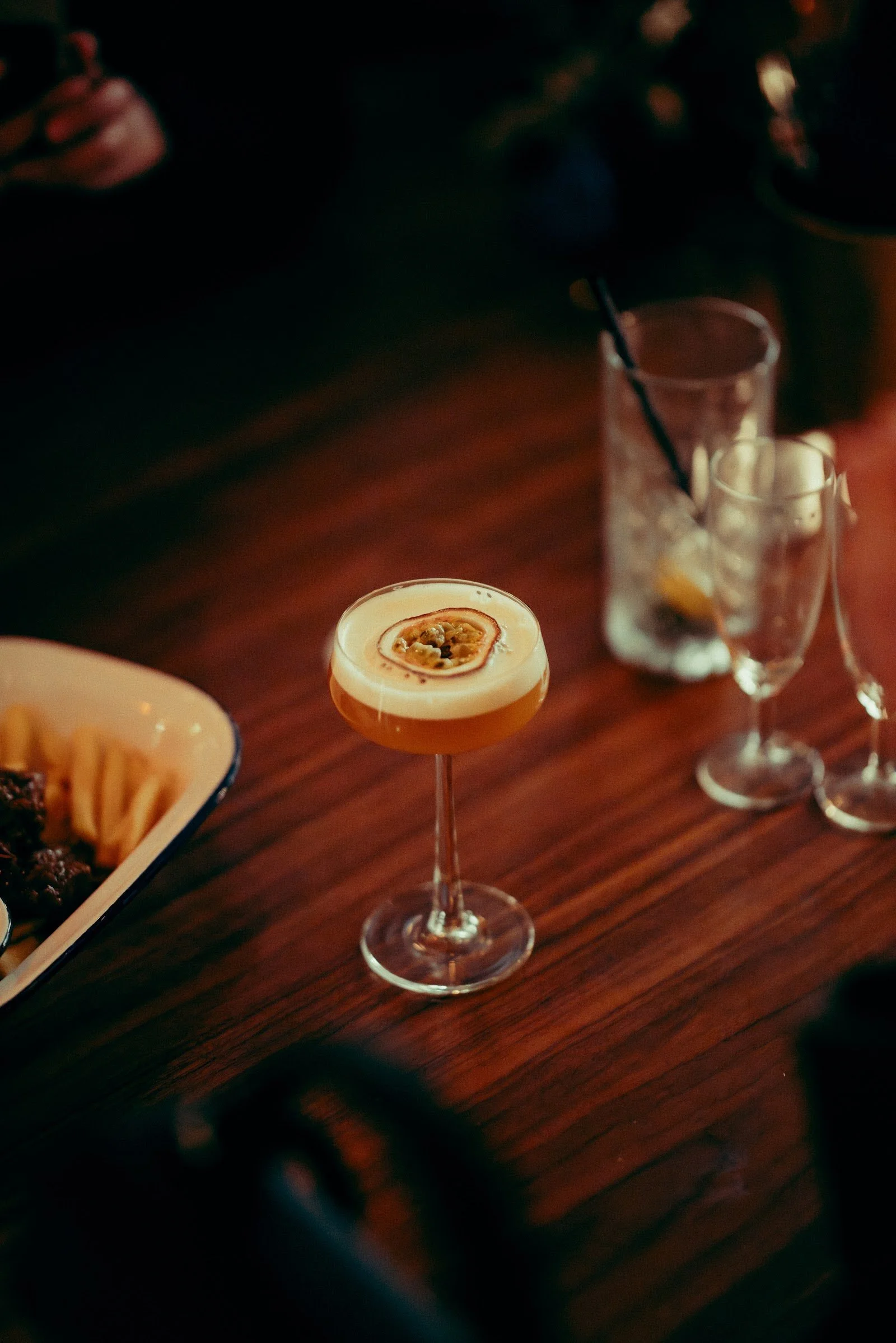 Signature cocktail served on a wooden table