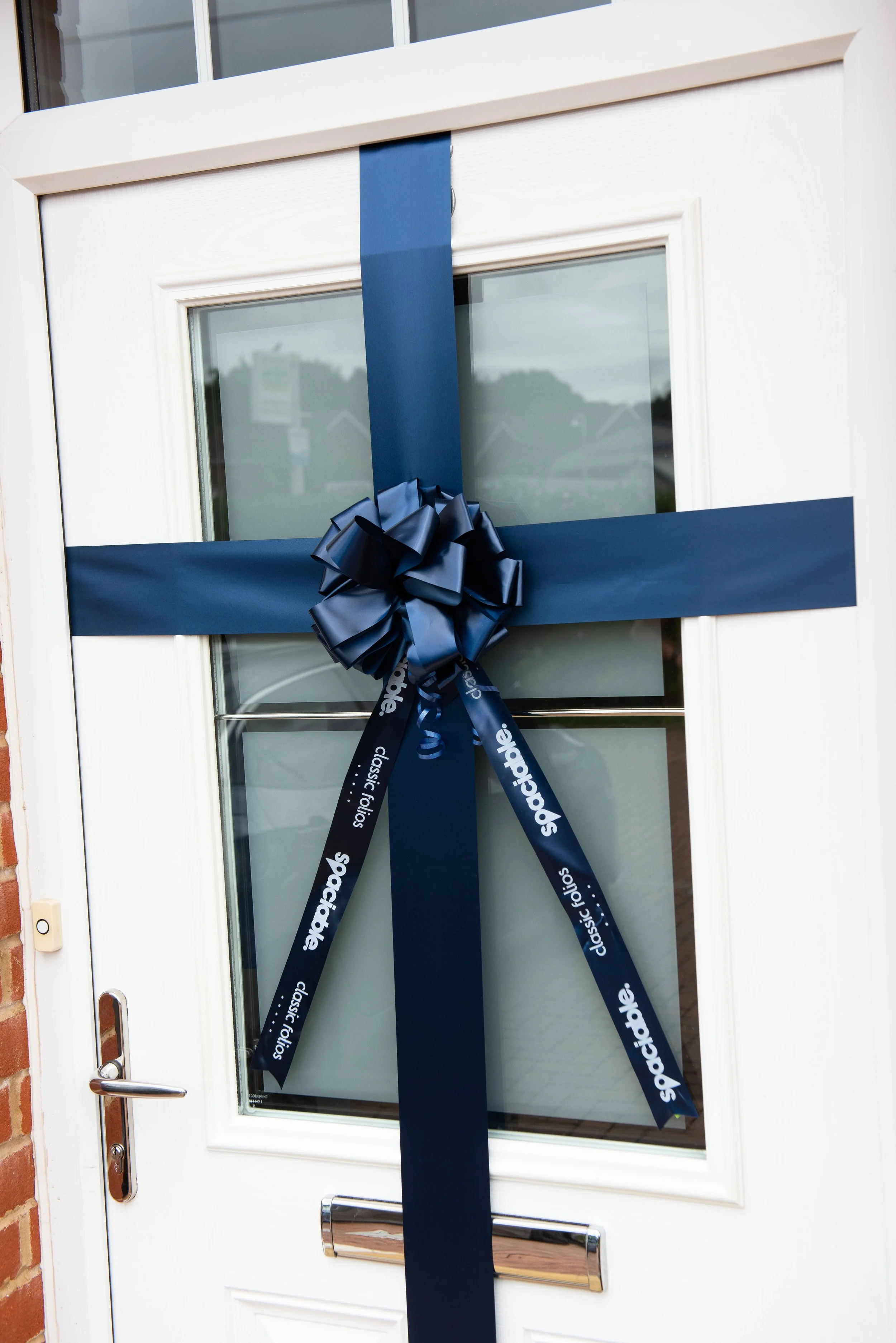 Navy door bow on new build front door