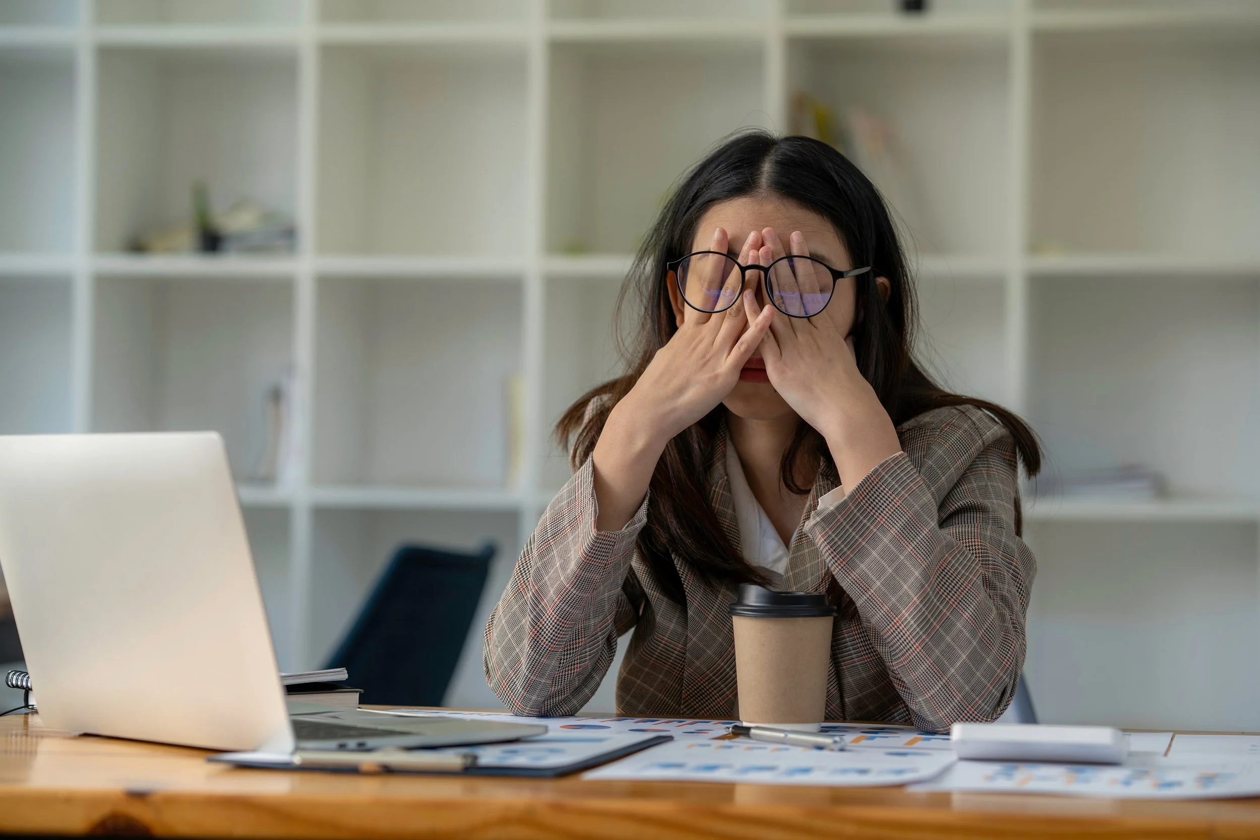 Tired woman sitting on the edge of the bed — unrefreshing sleep and low energy are hallmark hypothyroid symptoms, and thyroid conditions are far more common in women