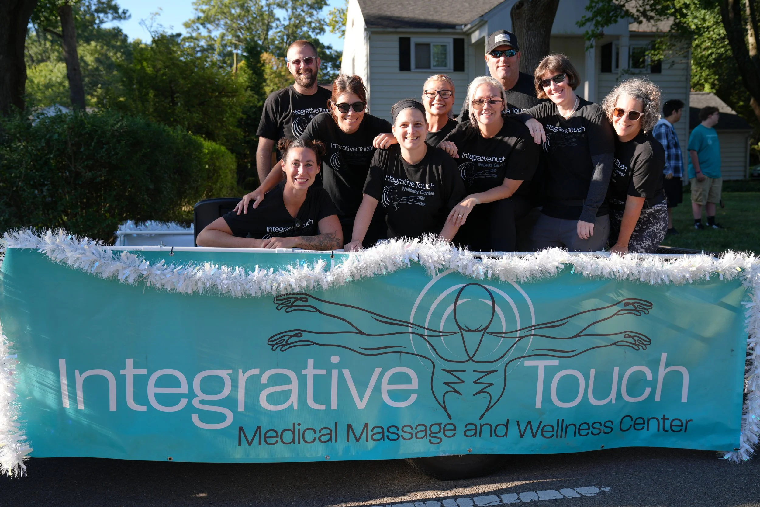 Integrative Touch Wellness Center team with banner