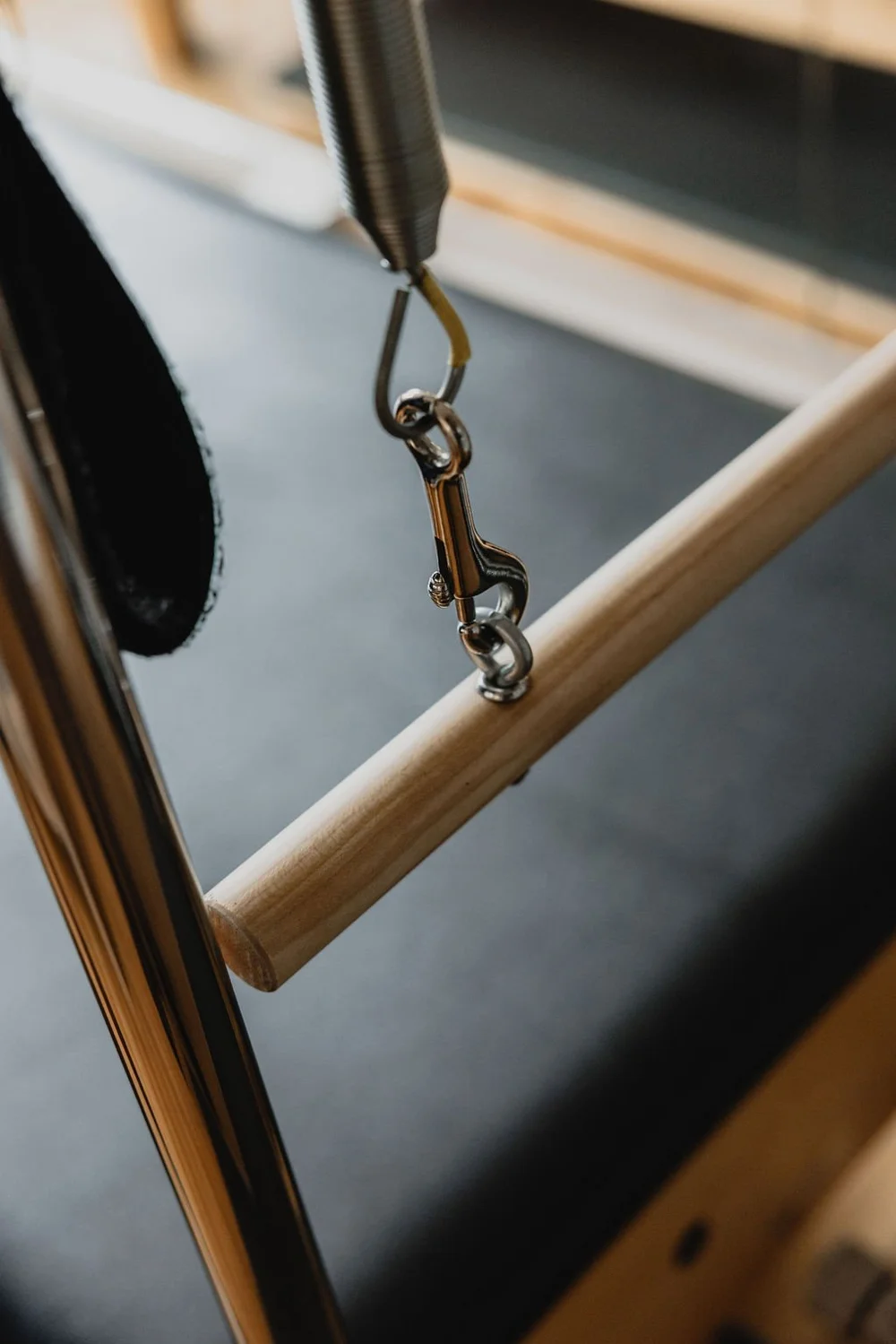 Wooden Cadillac bar, spring and strap detail at Studio Mōtus